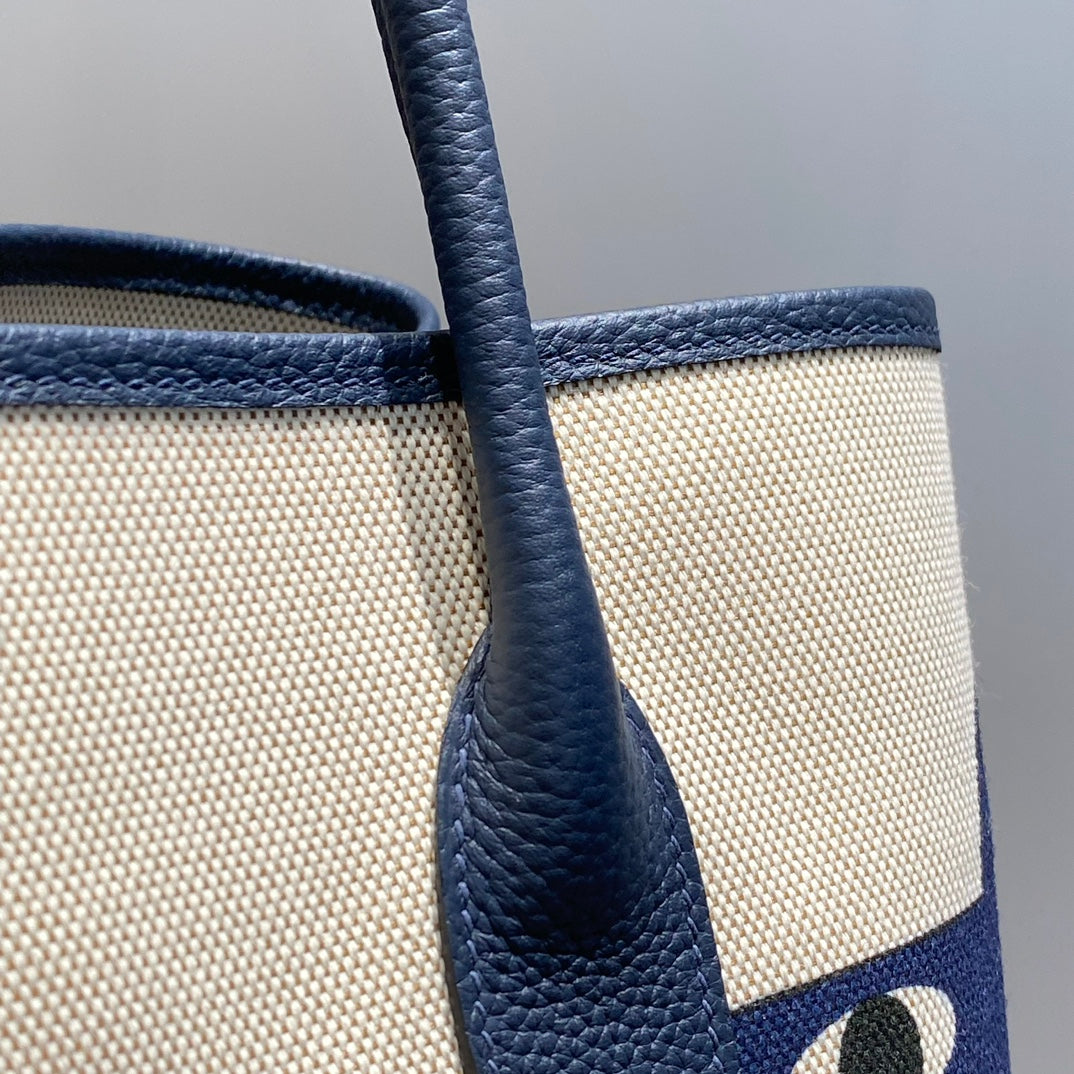 Hermes Garden Party 36 in Navy Cream Toile H Canvas Blue Marine Calfskin Abstract Bear Face Print Bag