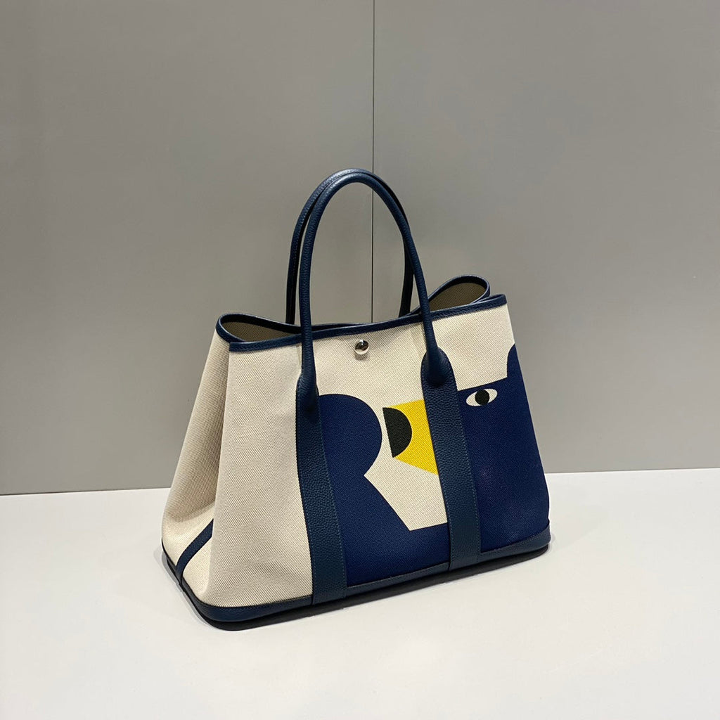 Hermes Garden Party 36 in Navy Cream Toile H Canvas Blue Marine Calfskin Abstract Bear Face Print Bag
